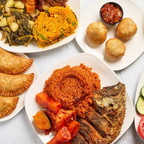 A vibrant spread of Senegalese dishes, including jollof rice, fried fish, meat pies, and vegetable stews.
